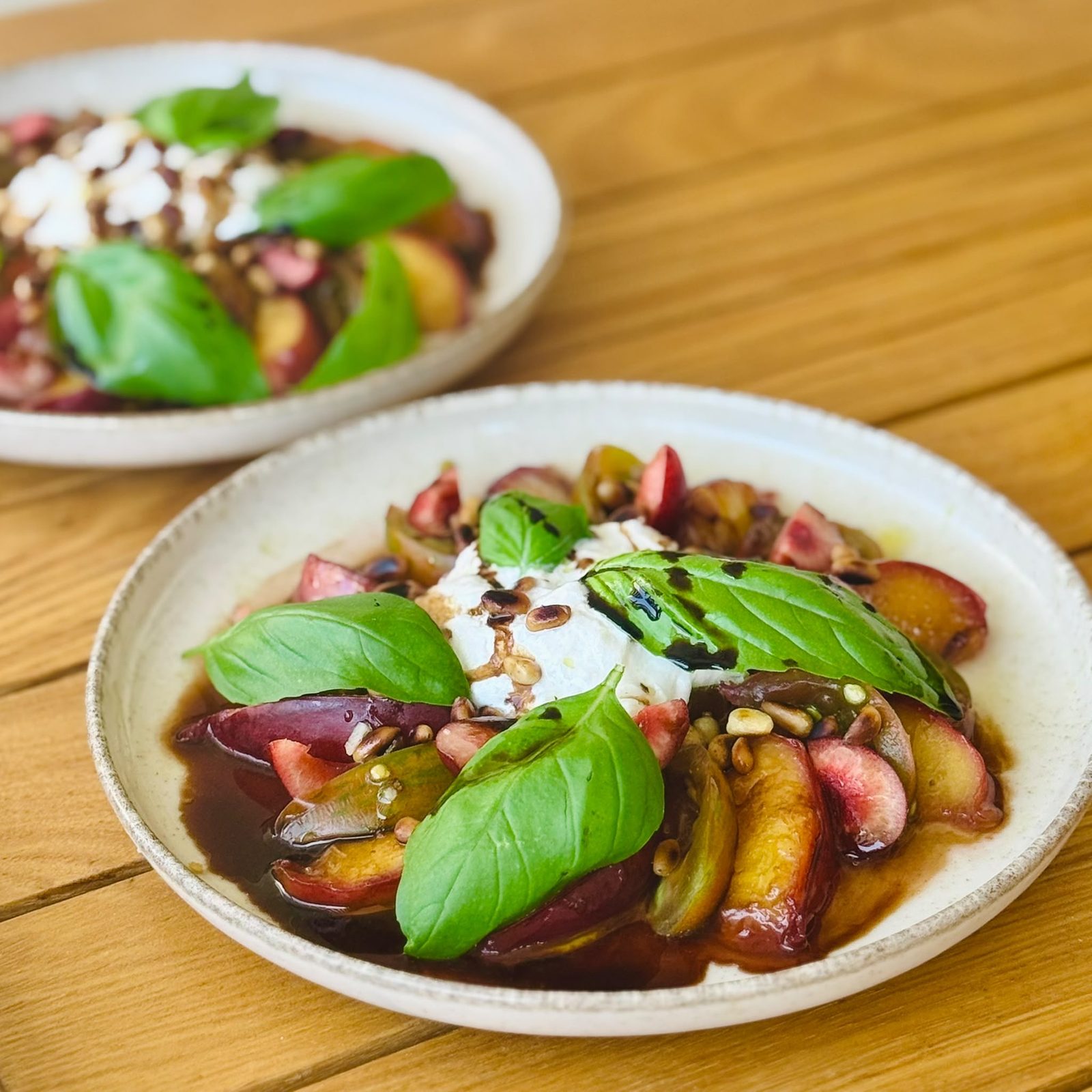 Summer Burrata with roasted peaches, sherry reduction, and toasted pine nuts
